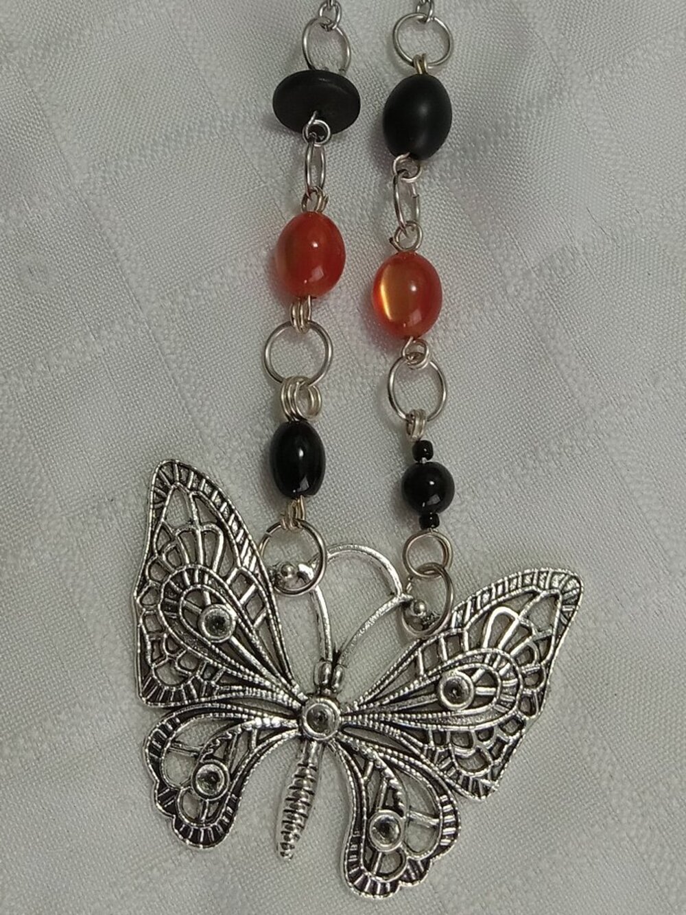 A pretty, minimalist, asymmetrical, reversible handmade necklace
